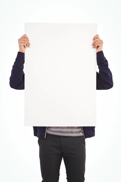 Homem mostrando cartaz na frente da cara — Fotografia de Stock