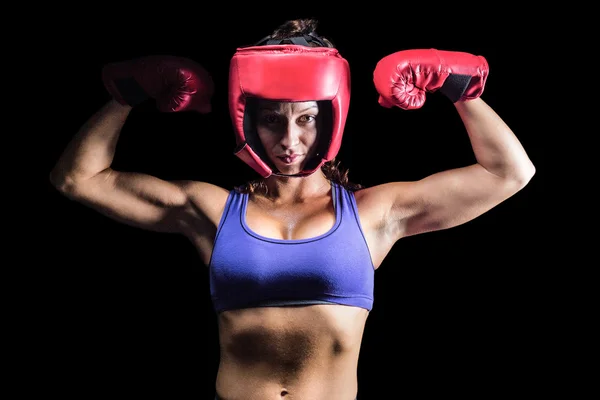 Portrait of confident female fighter flexing muscles — Stock Photo, Image