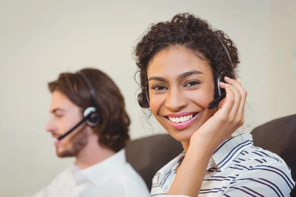 Portrait of smiling businesswoman in call center — Stock Photo, Image