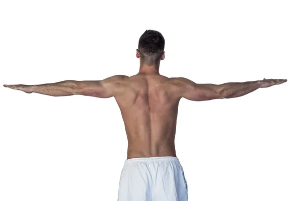 Visão traseira de um homem esticando os braços — Fotografia de Stock