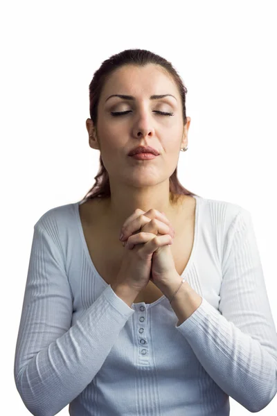 Beautiful woman praying with joining hands and eyes closed — Stock Photo, Image