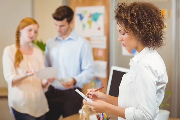 Businesswoman writing on document — Stock Photo, Image