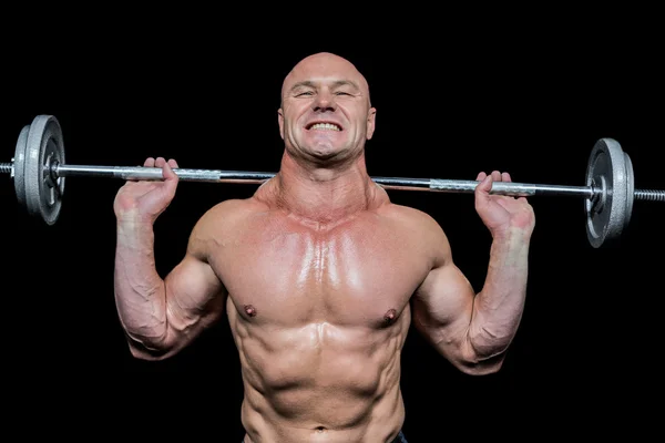 Zelfverzekerde gespierde man hijs crossfit — Stockfoto