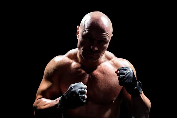 Shadow falling on confident fighter — Stock Photo, Image