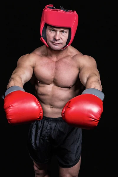 Portrait of boxer with red gloves and headgear — Stock Photo, Image