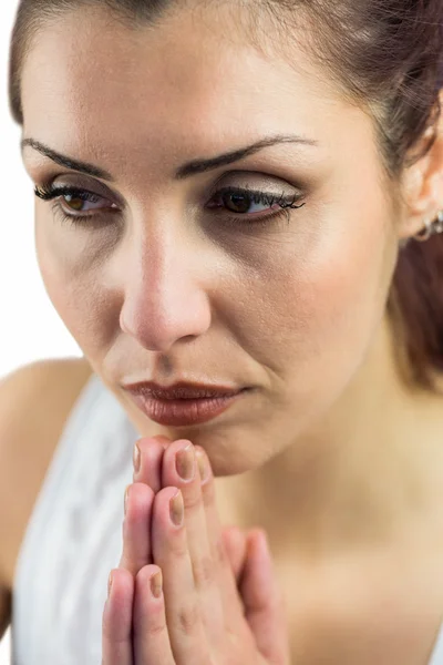 Close-up of woman with joined hands — Stock Photo, Image