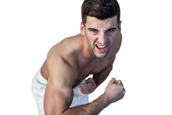 Portrét muže ukazující biceps — Stock fotografie