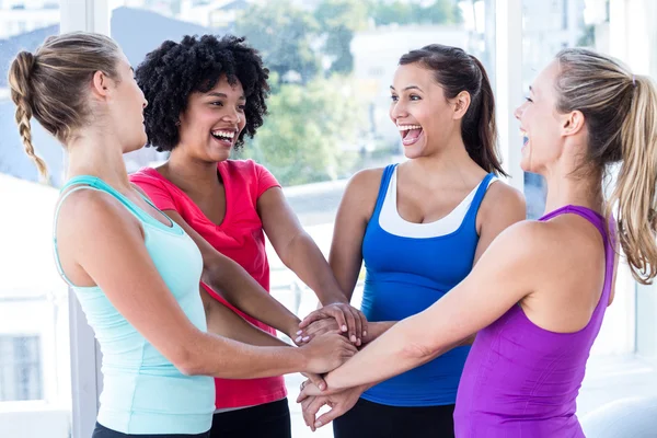 Fit women enjoying while holding hands — Stock Photo, Image