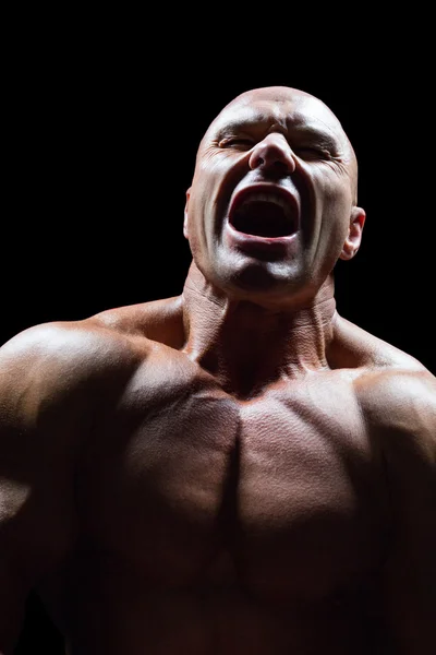 Aggressive muscular man — Stock Photo, Image