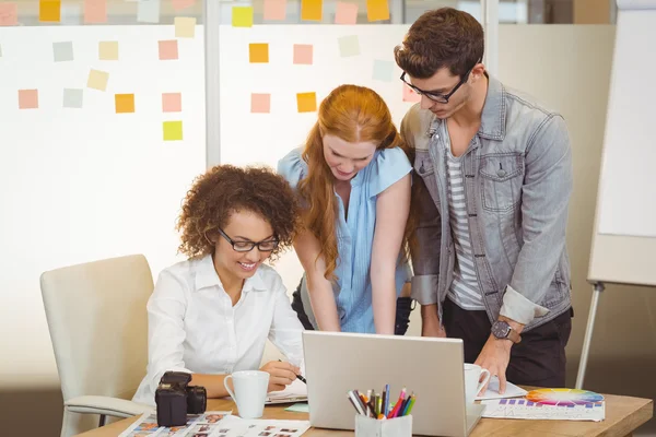 Smiling businesswoman with colleagues — Stock Photo, Image