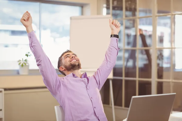 Businessman with arms raised looking up — Stock Photo, Image