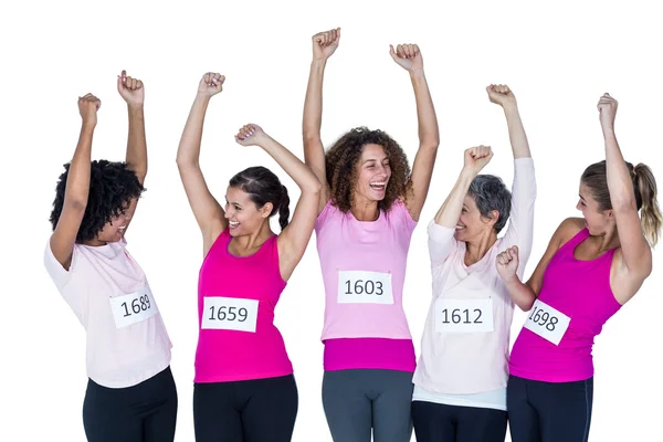 Happy athletes with arms raised — Stock Photo, Image