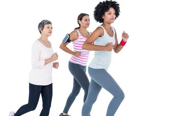 Determined female friends jogging — Stock Photo, Image