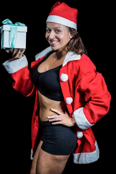 Retrato de atleta mujer feliz en traje de Navidad mientras sostiene —  Fotos de Stock