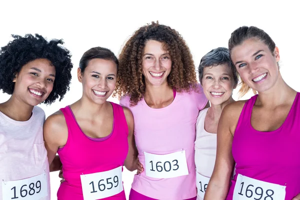 Portrait of smiling female athletes with arms around — Stock Photo, Image