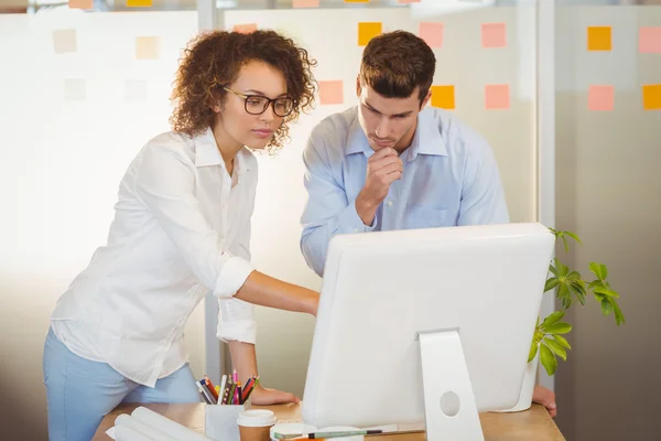 Business people standing by table — Stock Photo, Image