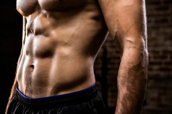 Midsection of man showing his abs — Stock Photo, Image
