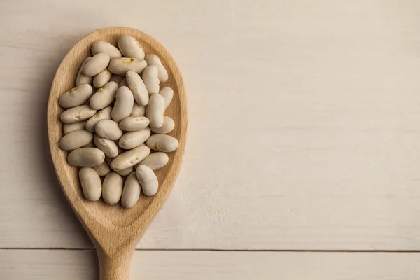 Cucchiaio di legno di fagioli di Lima — Foto Stock