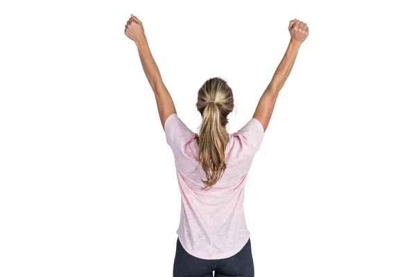 Rear view of woman cheering with arms raised — Stock Photo, Image