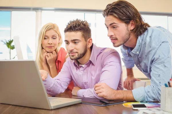 Business people focusing on laptop — Stock Photo, Image