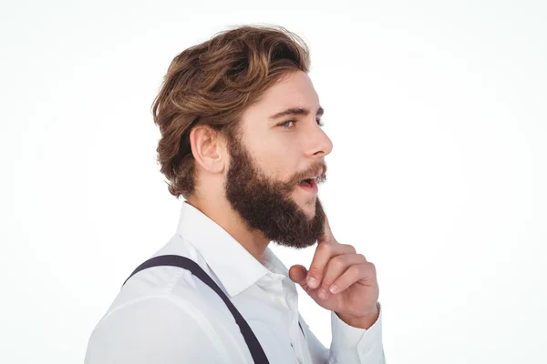 Thoughtful hipster with finger on chin — Stock Photo, Image