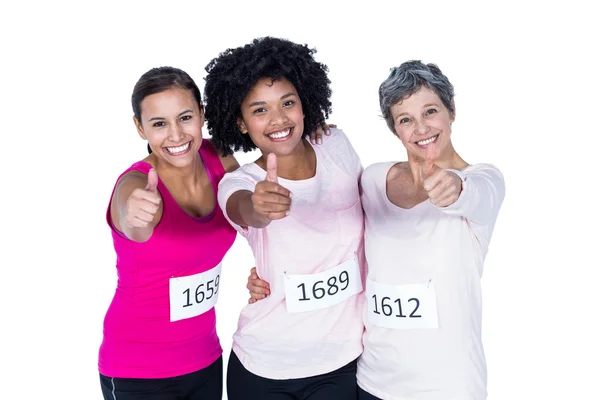 Portrait of smiling female athletes with thumbs up — Stock Photo, Image