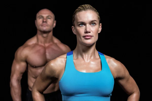 Entrenadores musculares mirando hacia otro lado —  Fotos de Stock