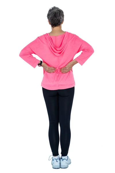Mujer en ropa deportiva masaje espalda —  Fotos de Stock