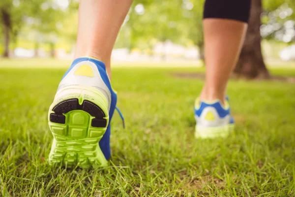 Low section of woman wearing shoes at park — Stock Photo, Image