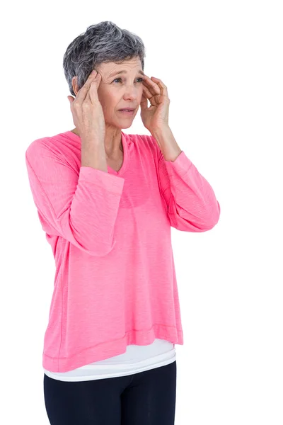 Mature woman massaging head — Stock Photo, Image