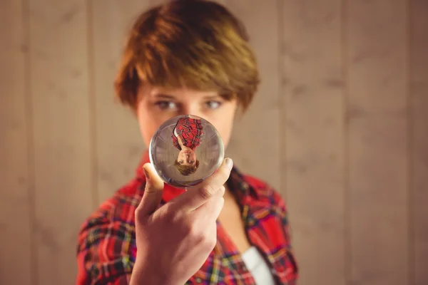 Beautiful woman holding a sphere — Stock Photo, Image