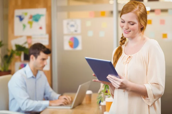 Businesswoman holding digital tablet — Stock Photo, Image