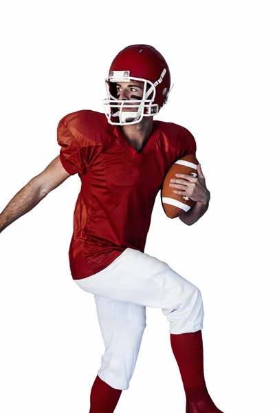 Rugby player holding the ball and looking behind — Stock Photo, Image