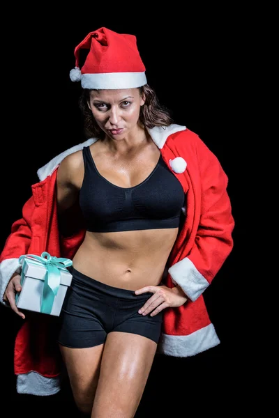 Retrato de atleta confiante em traje de Natal enquanto segurando — Fotografia de Stock