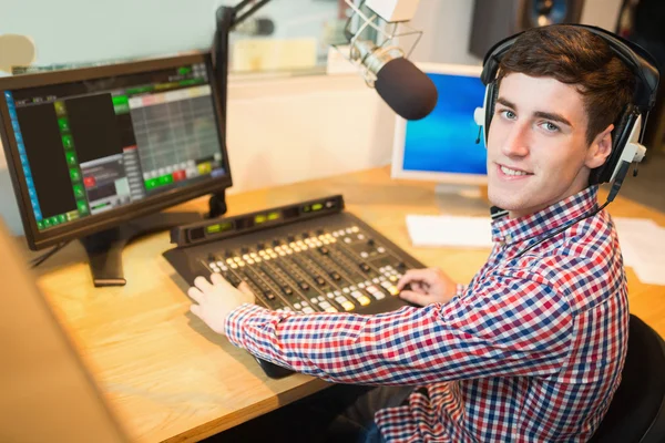 Radio host operating sound mixer — Stock Photo, Image