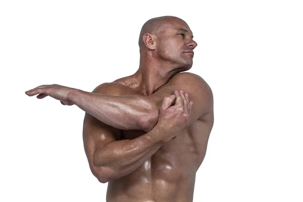 Homme musclé étirant les mains — Photo