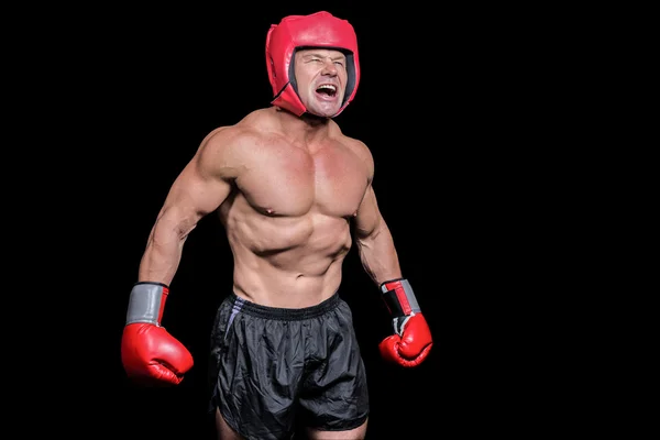 Angry boxer against black background — Stock Photo, Image