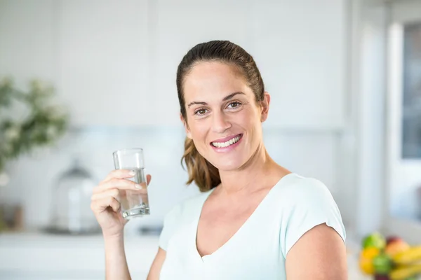 Portrait of happy woman holding water — Stock Photo, Image