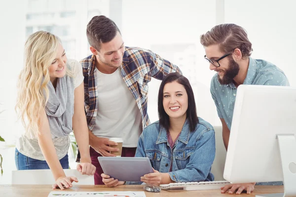 Cheerful business professionals using digital tablet — Stock Photo, Image