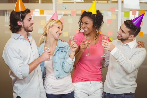 Colleagues enjoying birthday party with champagne — Stock Photo, Image