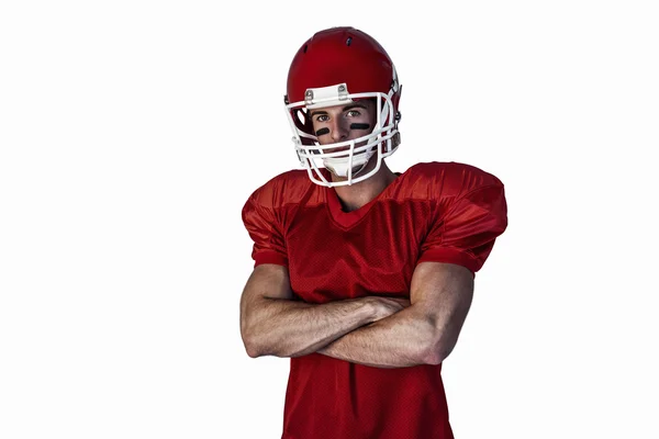 Retrato de jogador de rugby usando capacete com os braços cruzados — Fotografia de Stock