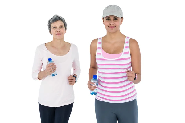 Women with bottle jogging — Stock Photo, Image