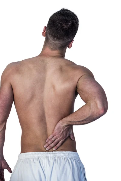 Вид сзади на человека, страдающего от болей в спине — стоковое фото