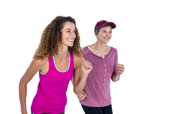 Felizes amigos do sexo feminino jogging — Fotografia de Stock