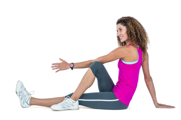 Vista lateral de la mujer joven haciendo ejercicio —  Fotos de Stock