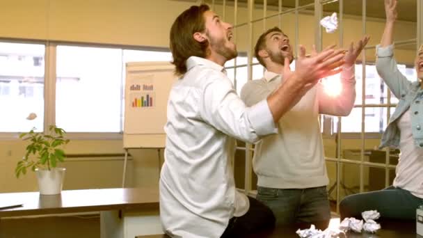 Creative team throwing crumpled balls of paper Royalty Free Stock Footage