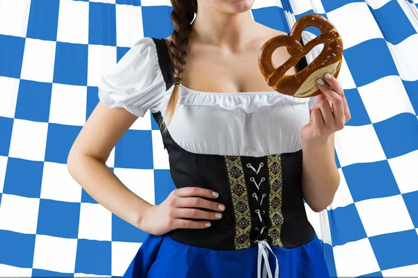 Oktoberfest girl holding pretzel — Stock Photo, Image