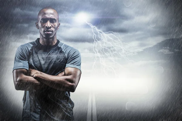 Portrait of athlete standing with arms crossed — Stock Photo, Image