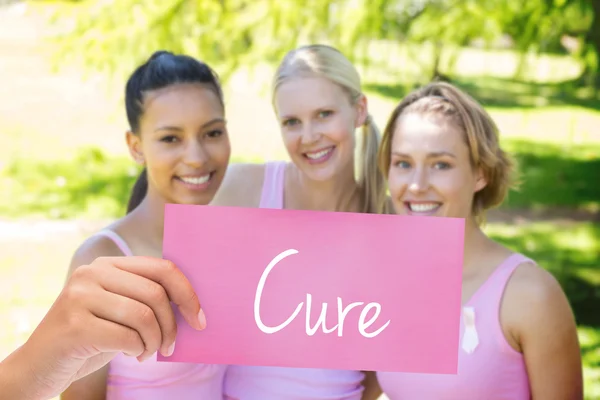 Cure against smiling women in pink — Stock Photo, Image