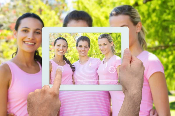 Composite image of hand holding tablet pc — Stock Photo, Image